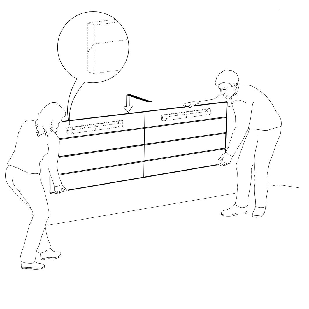 Diagram for step 12: Two people lift and position the long drawer unit against the wall while aligning the top back area as indicated by the zoom callout and downward arrow.